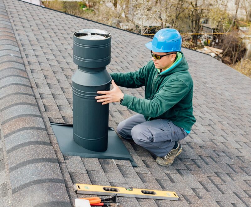 worker-with-blue-helmet-on-the-roof-installing-iro-2024-10-20-19-08-55-utc-min